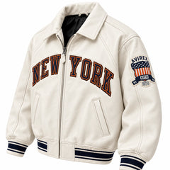 Three-quarter view of cream New York varsity bomber with Avirex Kith 1975 sleeve patch and zip closure