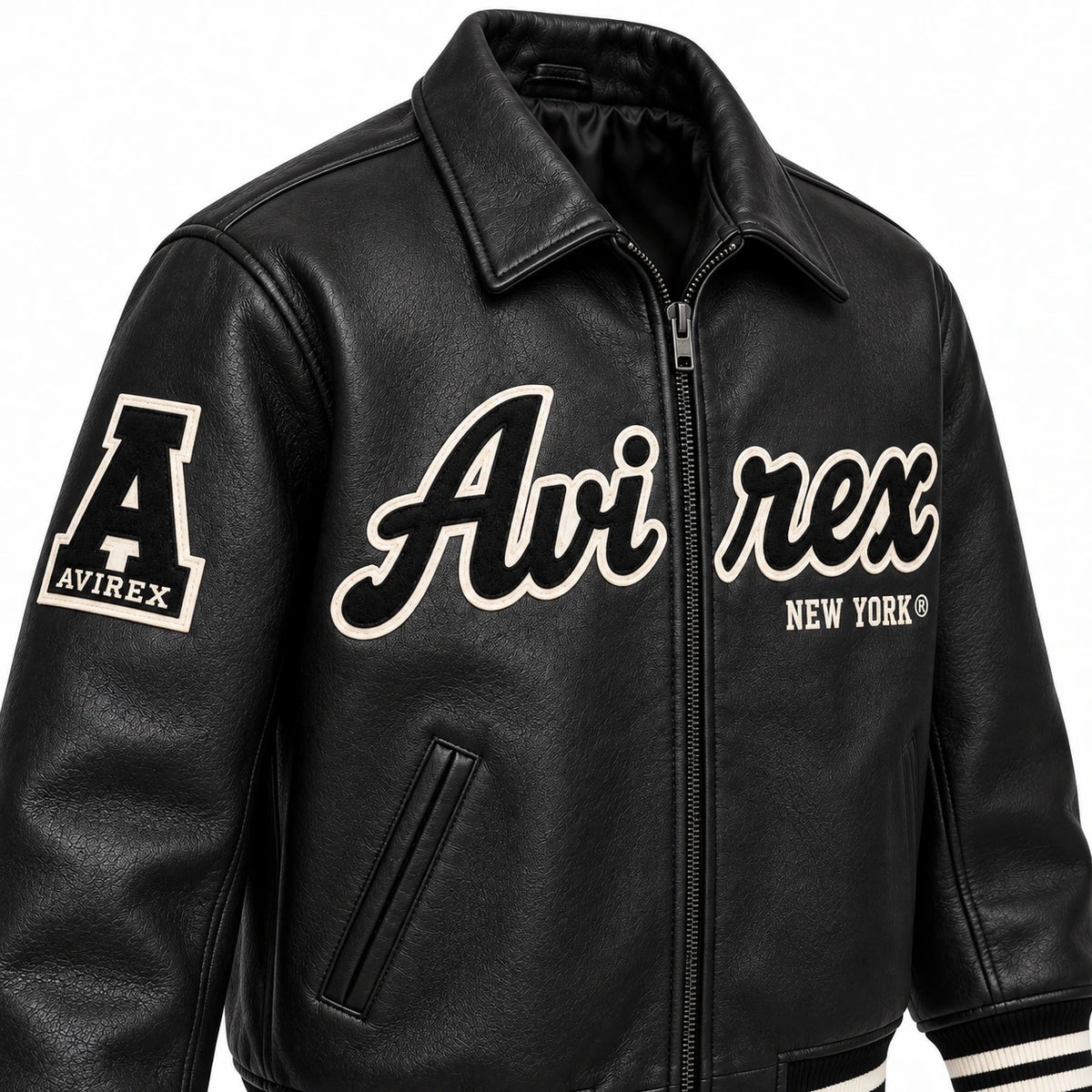 Three-quarter front view of Avirex men’s black leather jacket with Avirex New York lettering, sleeve patch and zip closure