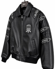 Close-up of Avirex black LDN leather jacket showing fold-down collar, chest shield patch and outlined sleeve graphics