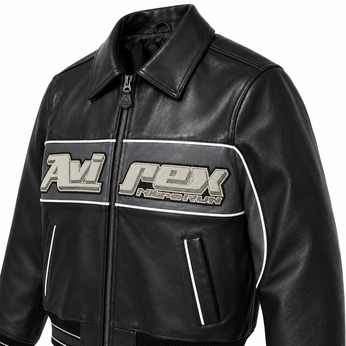Three-quarter front view of Avirex Nitro Run black leather jacket showing grey logo panel, white piping and vertical pockets