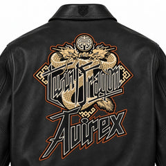 Close-up back view of Avirex black leather jacket showing gold Twin Dragon artwork and oversized Avirex lettering