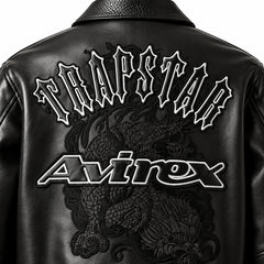 Close-up of Trapstar and Avirex back graphic on black lambskin leather bomber jacket