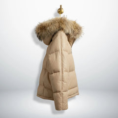 Side profile of beige leather puffer winter coat with fur hood.