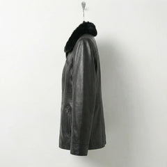 Side view of womens fitted black fur collar leather jacket