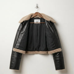Inside view of Leather Unit black shearling cropped jacket with lining