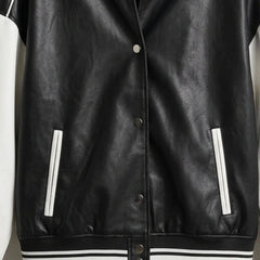 Front snap buttons and welt pockets on black and white leather varsity jacket