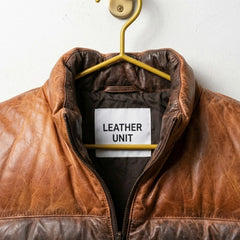 Close-up of stand-up collar and premium sheepskin leather on brown puffer jacket
