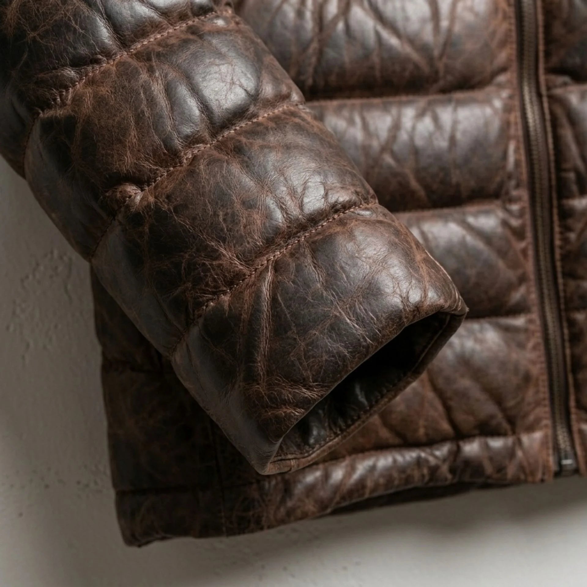 Detailed view of ribbed cuff and rich two-tone leather texture