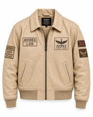Front view of cream leather flight jacket with aviation chest patches, angled pockets, zip closure and ribbed hem