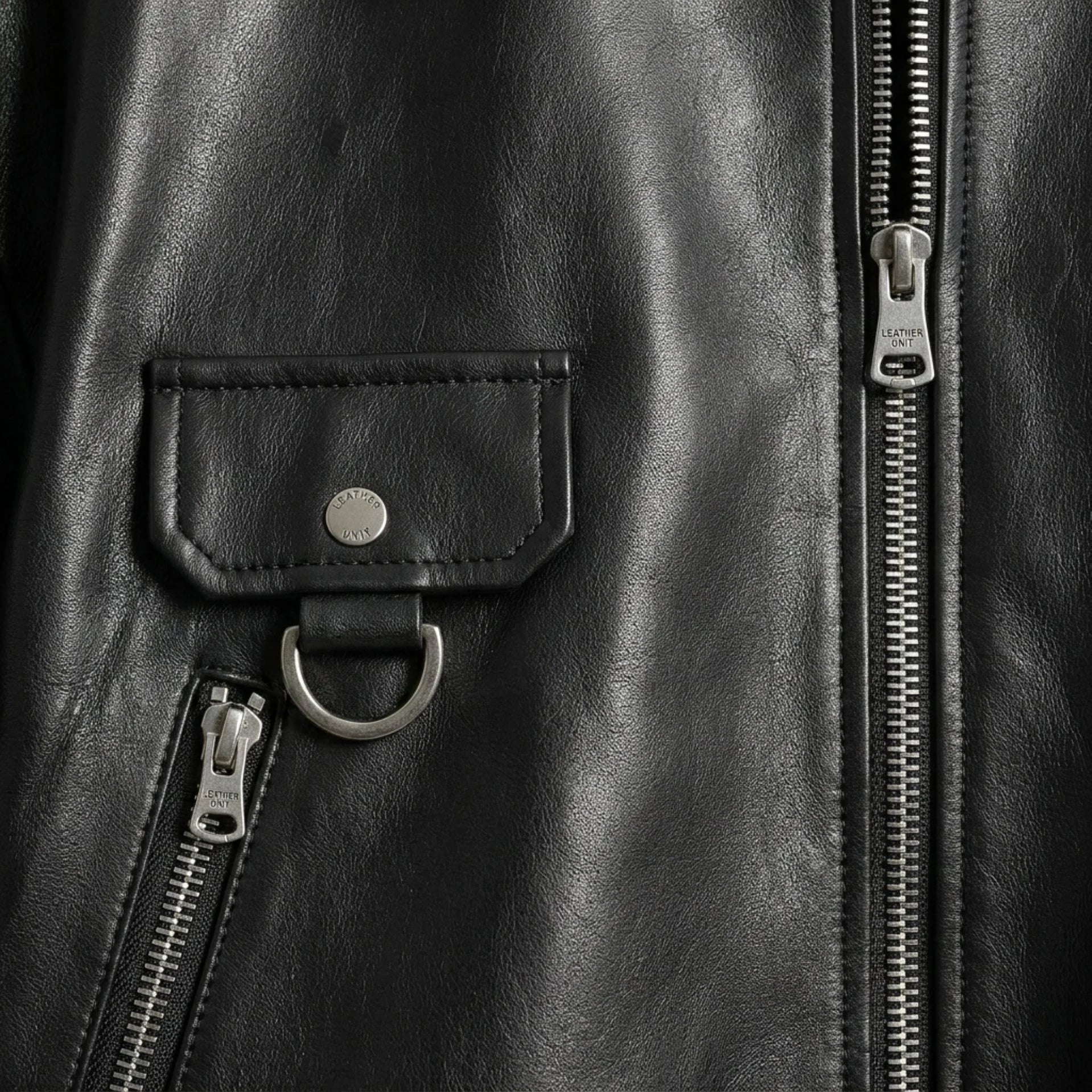 Zip pockets and flap pocket with D ring on black leather jacket women
