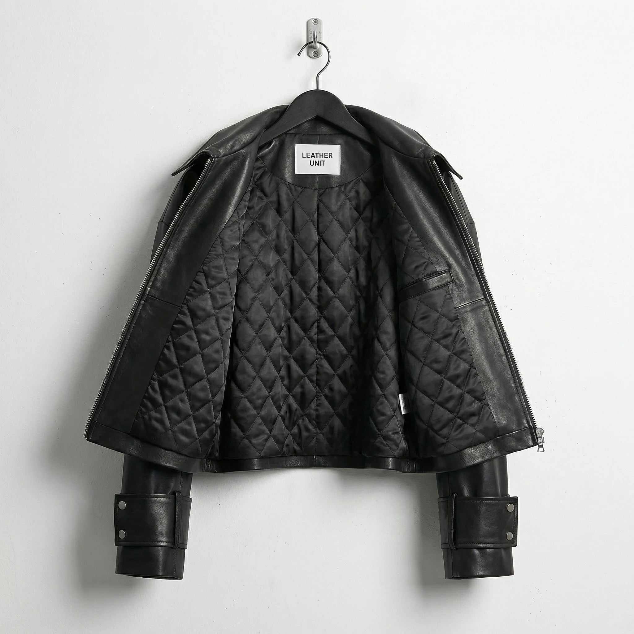 Quilted inner lining of womens cropped black leather jacket