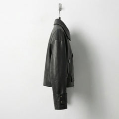 Side profile of womens black leather jacket with cuff straps