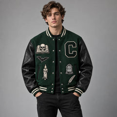 Front studio view of Crypt Academy forest green varsity jacket with skull, bat, candle and tombstone patches