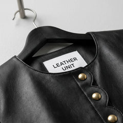 Leather Unit label and round neckline on women’s black scallop edge leather blazer