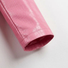 Sleeve cuff detail on croc-embossed blush pink leather blazer