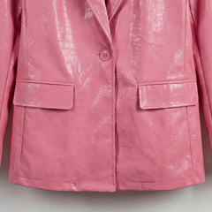 Single button front and flap pockets on women’s pink leather blazer