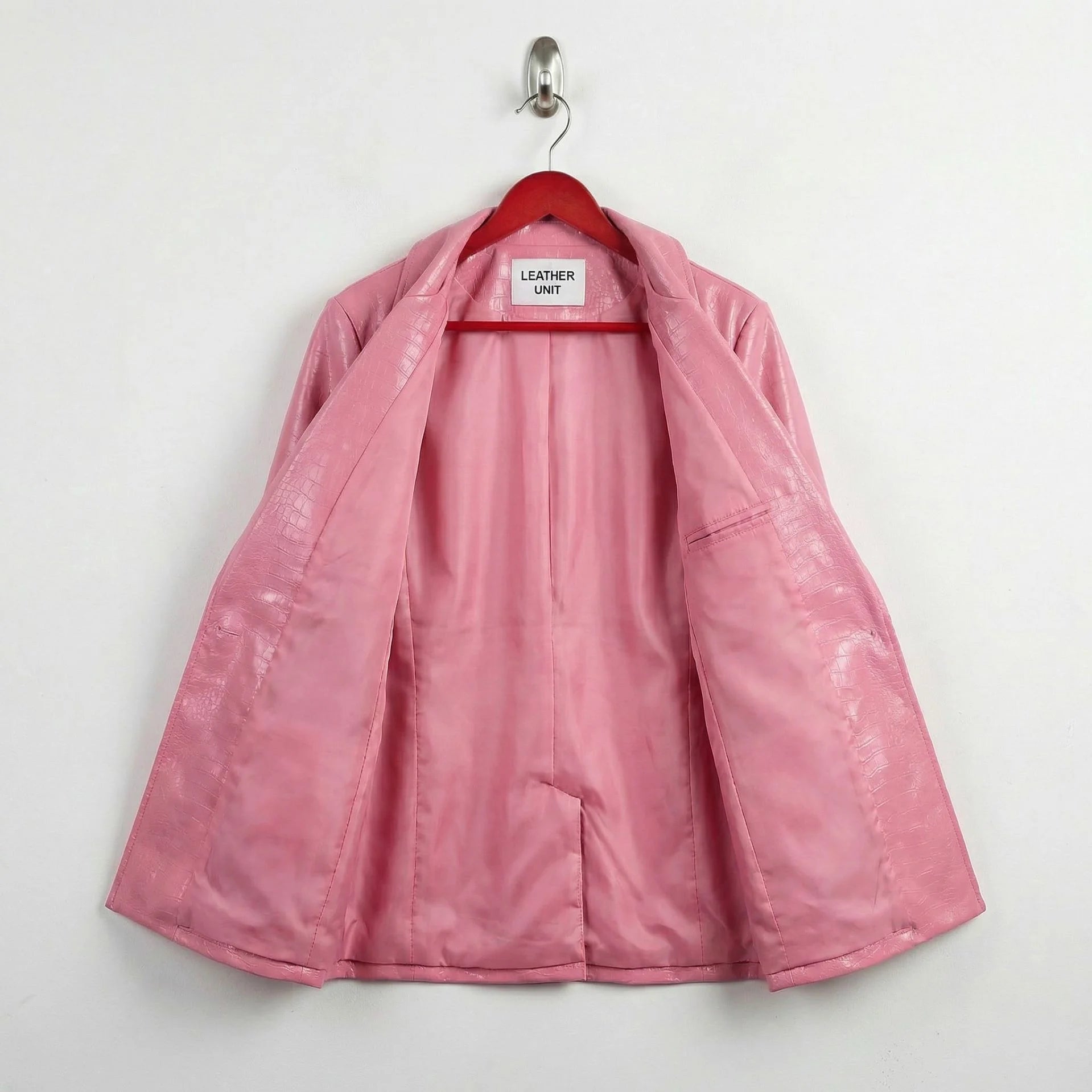 Inside lining of blush pink leather blazer with inner pocket