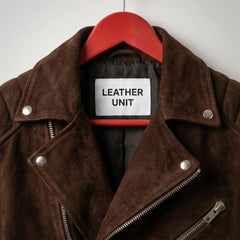 Lapel collar and branded label on men's brown suede biker jacket by Leather Unit