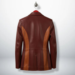 Back view of burgundy two‑tone leather blazer for women with curved camel panels