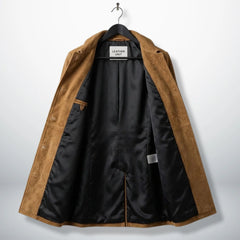 Inside lining of camel brown suede coat showing black interior