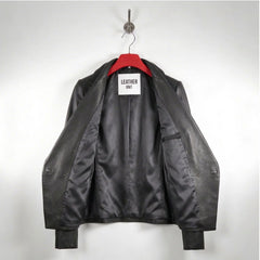 Inside lining of women’s black leather blazer showing interior pocket