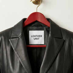 Close up of lapel collar and Leather Unit label on black leather blazer