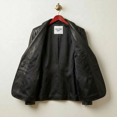 Inside lining of women’s black leather blazer showing interior pocket