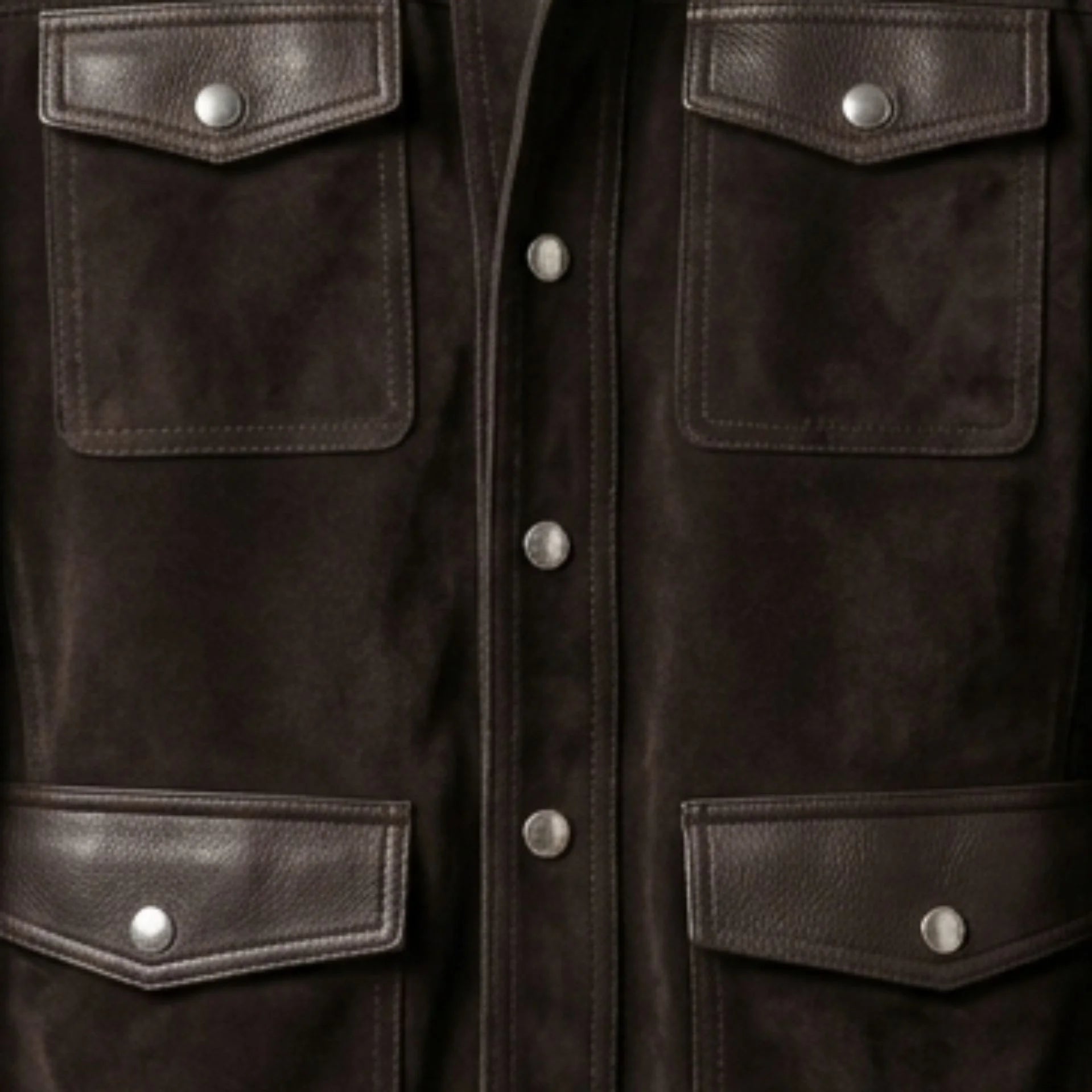 Front pocket and snap placket detail on men's brown suede trucker jacket