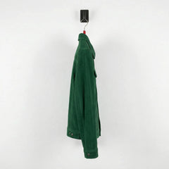 Side profile of men's green suede trucker jacket showing slim fit sleeves