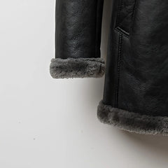 Turn‑back shearling cuff detail on men’s grey sheepskin parka coat