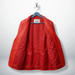 Inside lining of men’s red white striped leather blazer showing inner pockets