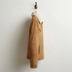 Side profile of men's tan suede trucker jacket with shearling collar