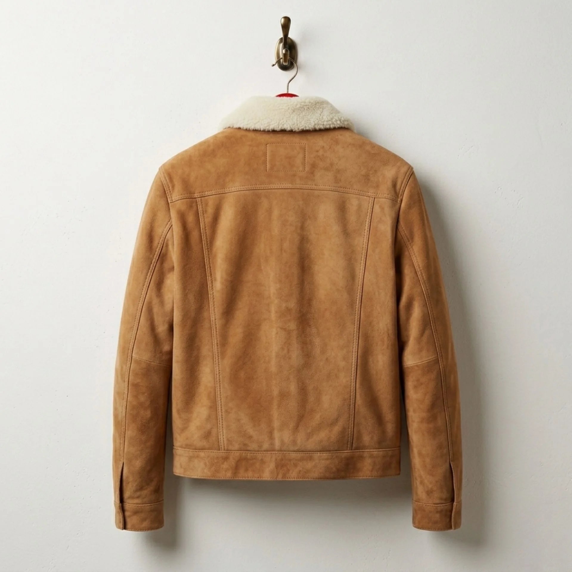 Back view of men's tan suede trucker jacket with hip length cut