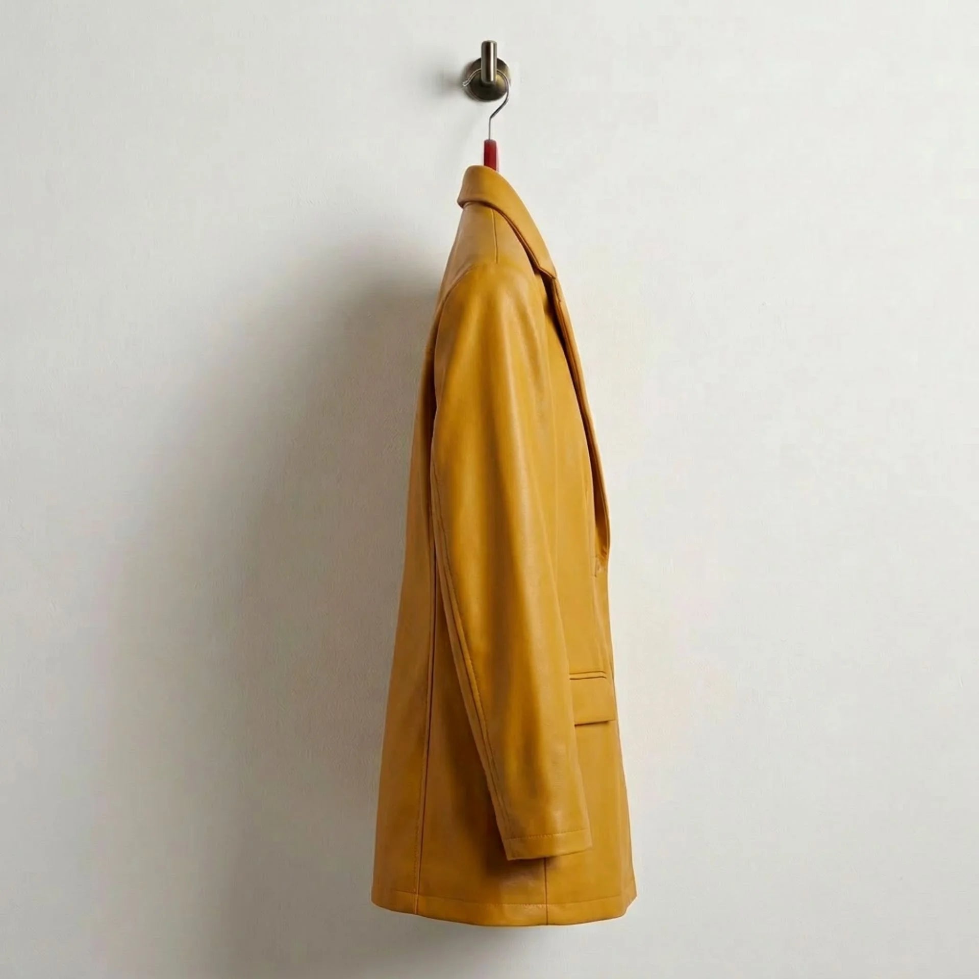 Side profile of longline mustard yellow leather blazer for women