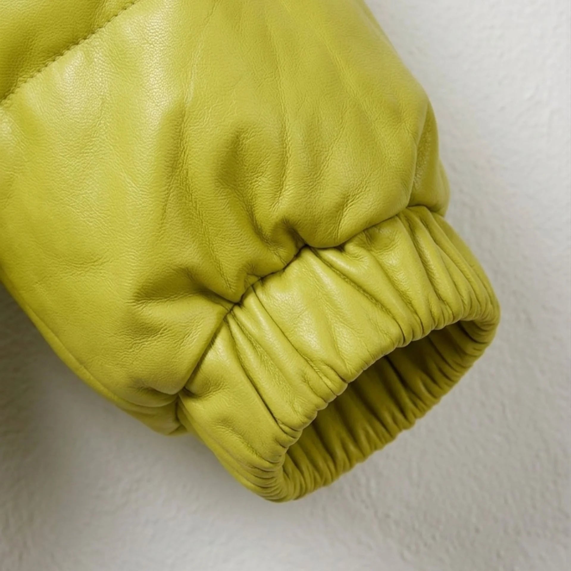 Elastic cuff detail on unisex neon lime leather puffer jacket