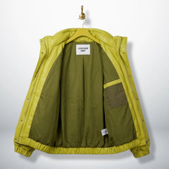 Interior olive lining of unisex neon lime puffer leather jacket showing inner pocket