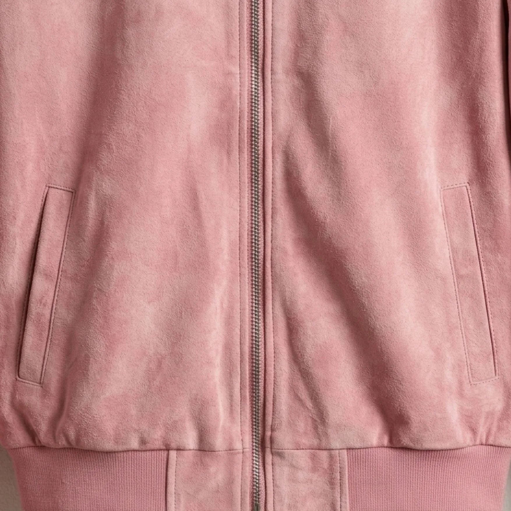 Front welt pockets and zipper detail on pink suede leather bomber jacket