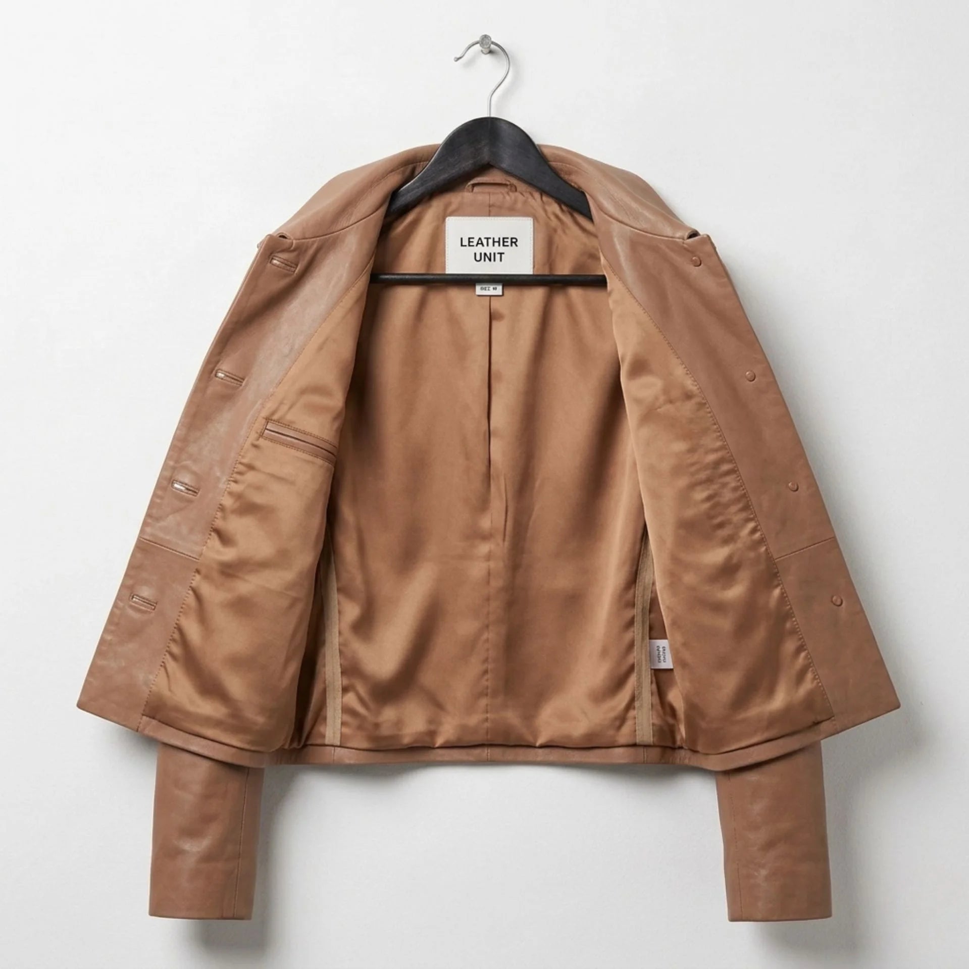 Women's tan cropped leather shirt jacket interior view with smooth lining