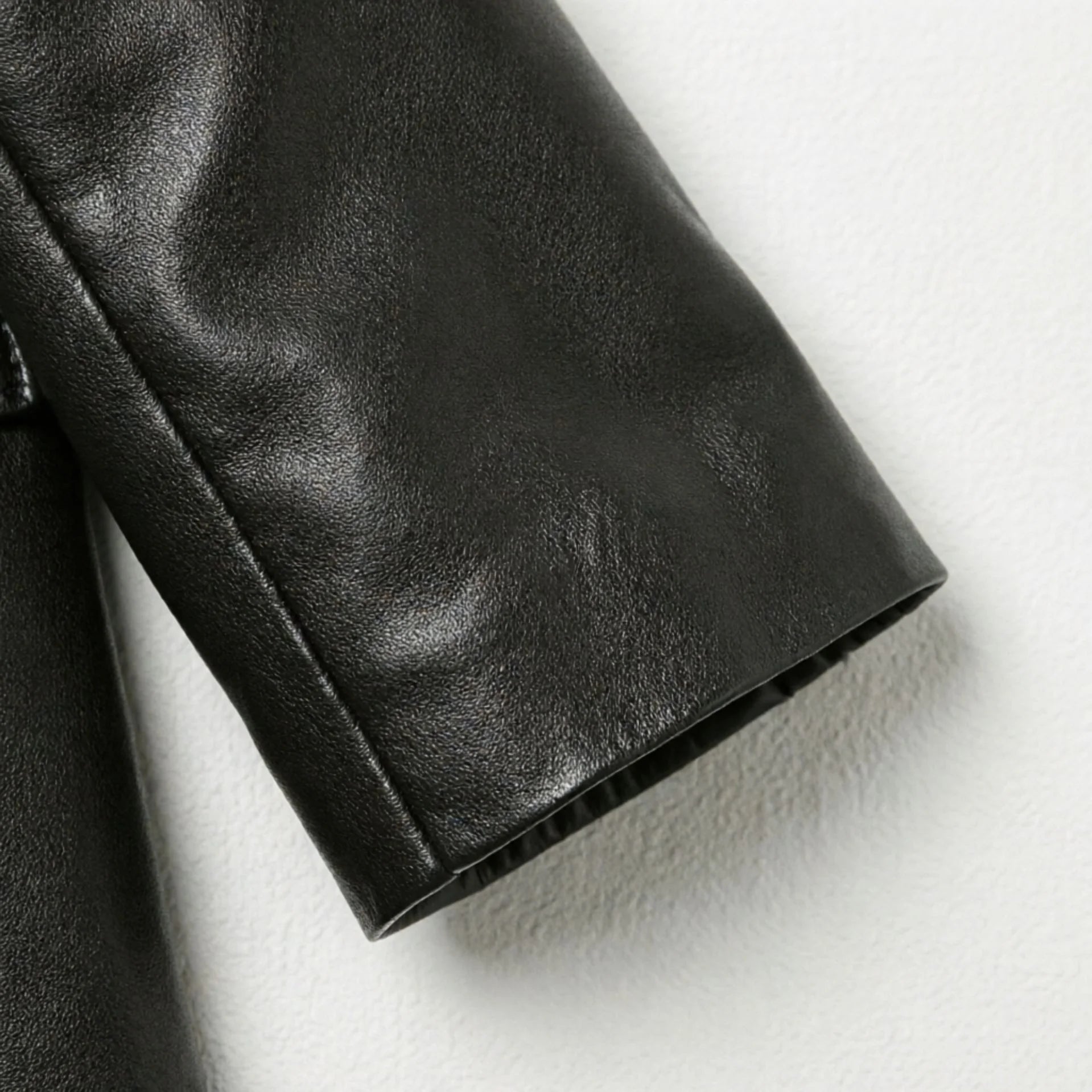 Sleeve cuff detail on women’s smooth black leather blazer