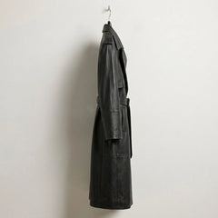 Side profile of long double breasted black leather trench coat