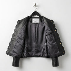 Interior lining of women’s black scallop edge leather jacket with inside pocket