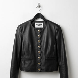 Front view of women’s black scallop edge leather jacket blazer
