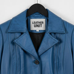 Close up of notch lapel and Leather Unit label on blue waxed leather coat