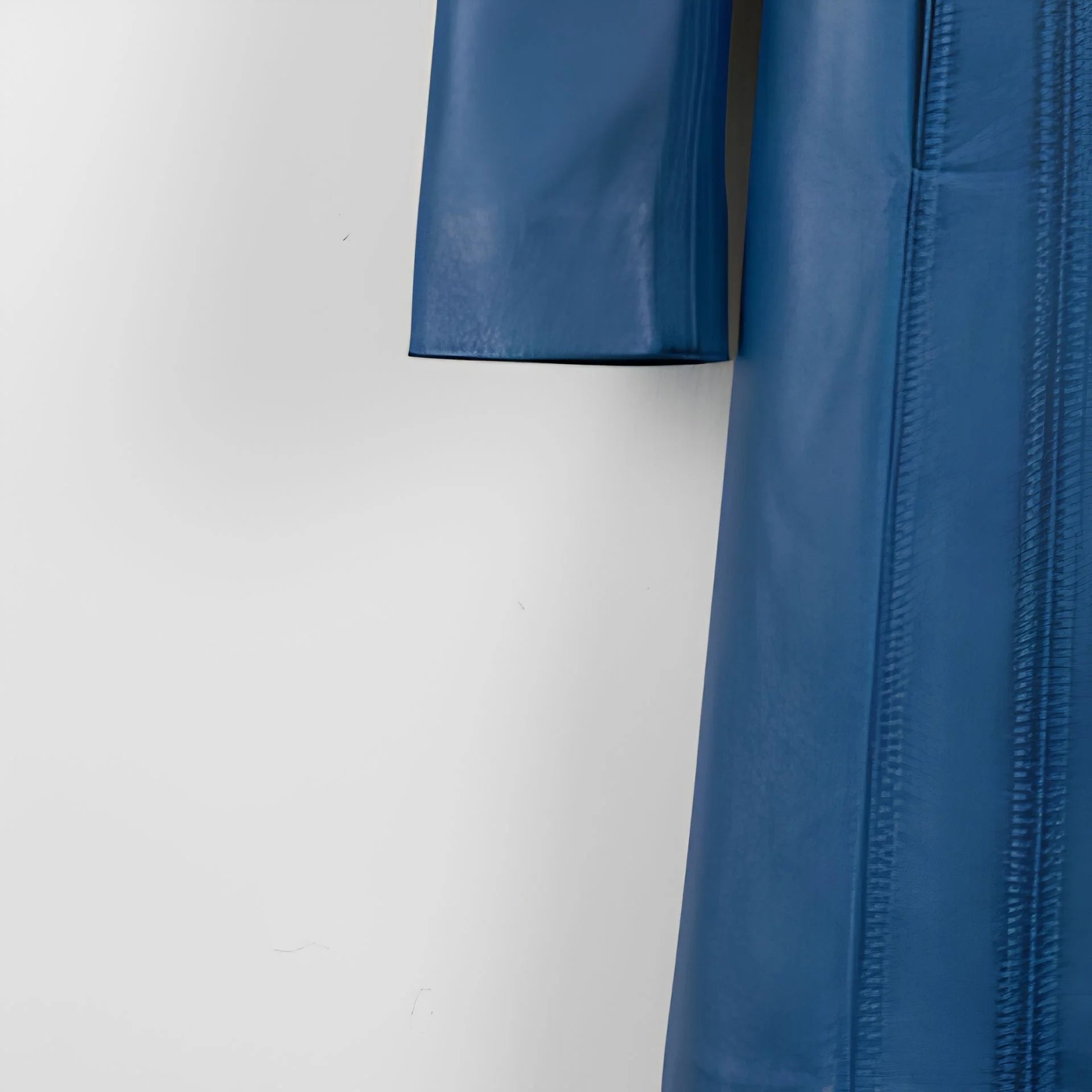 Sleeve and stitching detail on women’s blue genuine leather coat