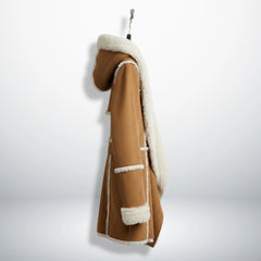 Side profile of mid‑thigh brown suede shearling coat with hood