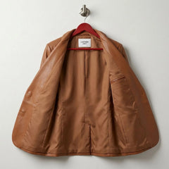 Interior lining and inside pocket of women’s cognac brown leather blazer