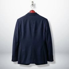 Back view of tailored women’s navy wool blazer jacket