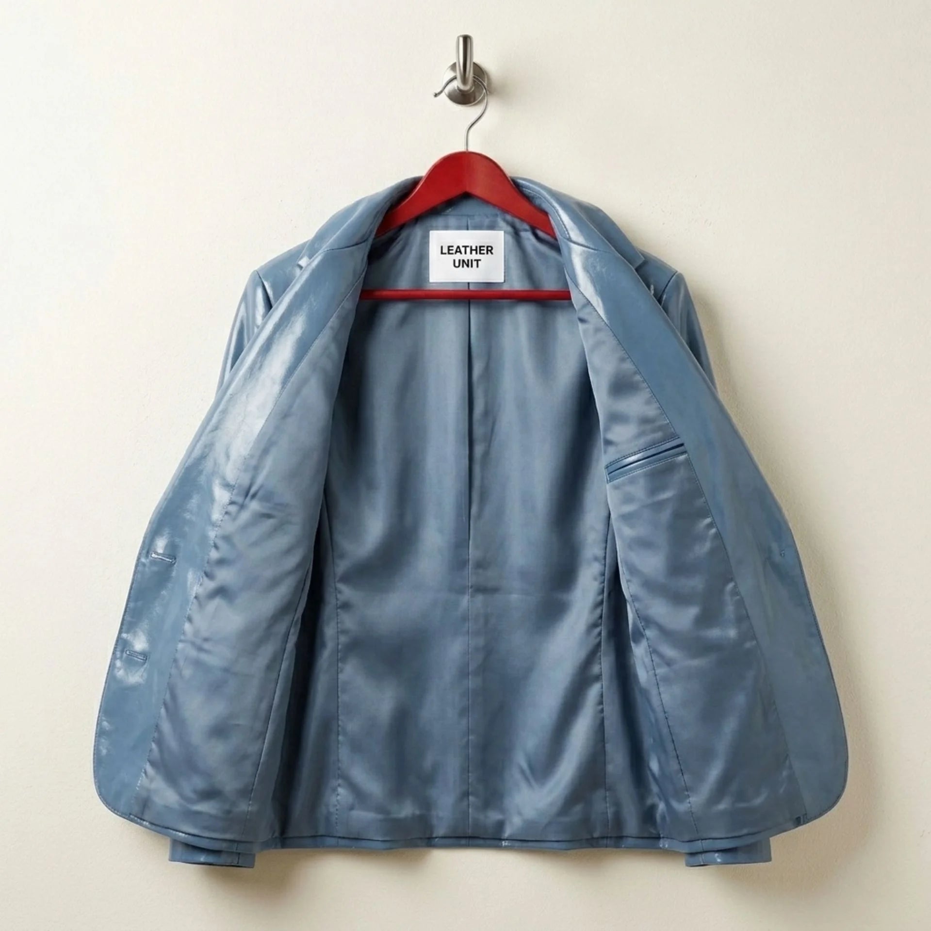 Inside lining and inner pocket of women’s sapphire blue leather blazer
