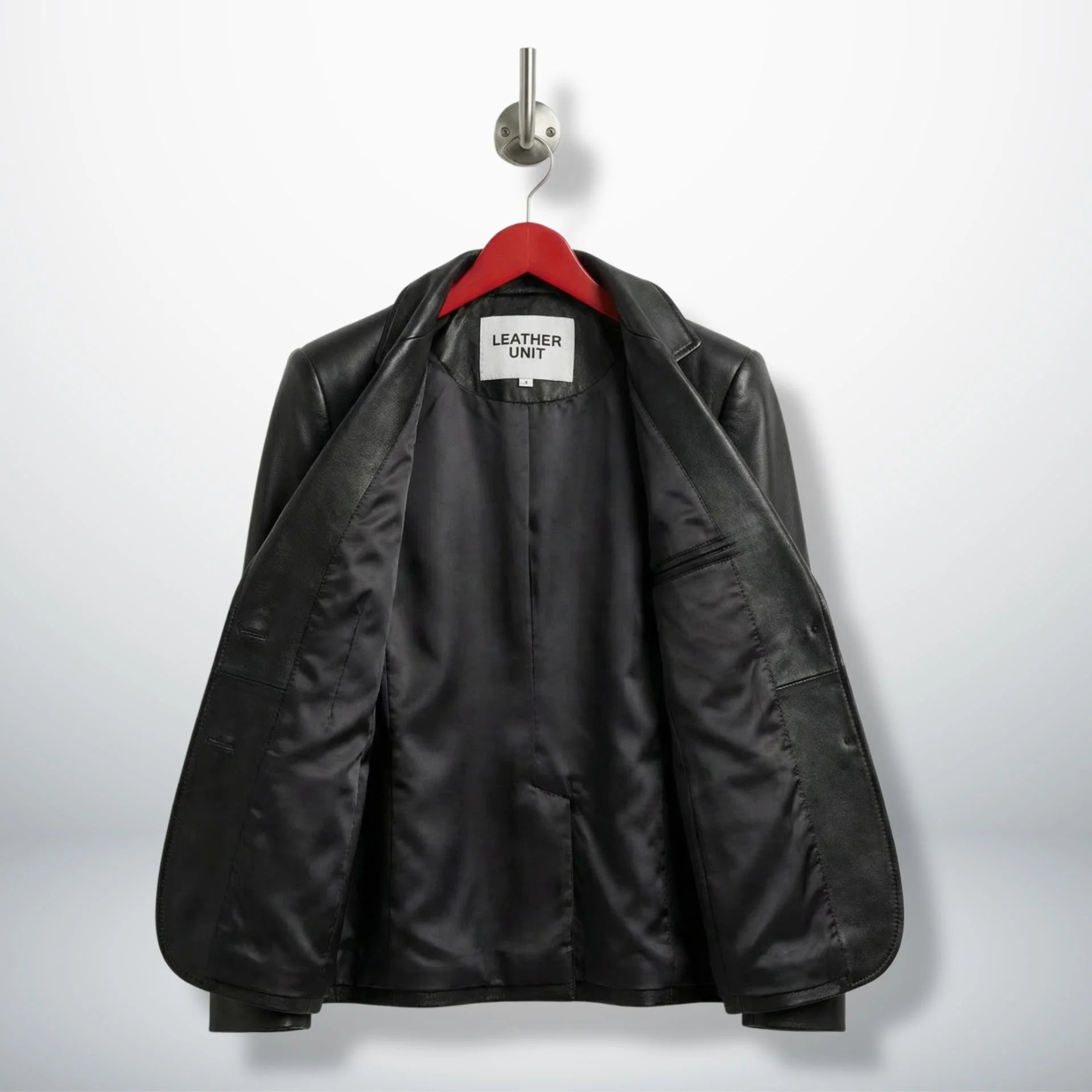 Inside lining of women’s black leather blazer showing interior pocket