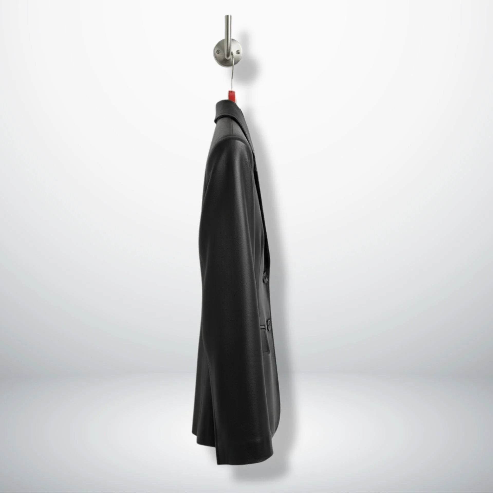 Side profile of hip‑length black leather blazer for women